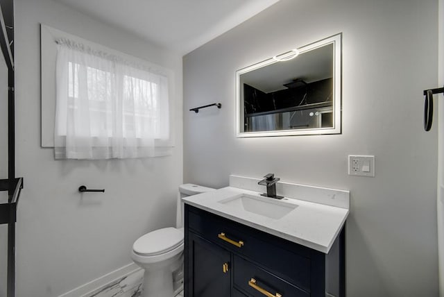 bathroom featuring vanity, a shower, and toilet