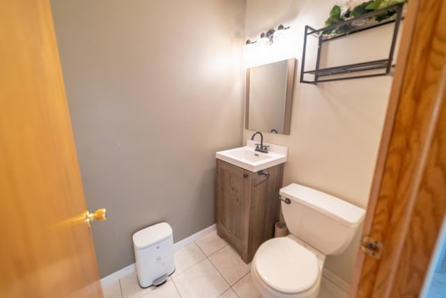 bathroom with vanity, tile patterned floors, and toilet