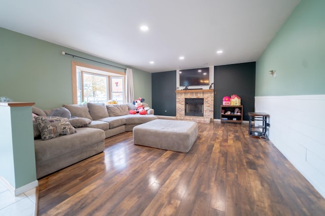 living room featuring dark hardwood / wood-style floors and a fireplace