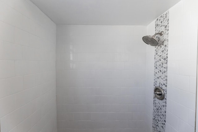 bathroom with tiled shower