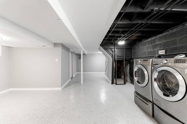 washroom with separate washer and dryer