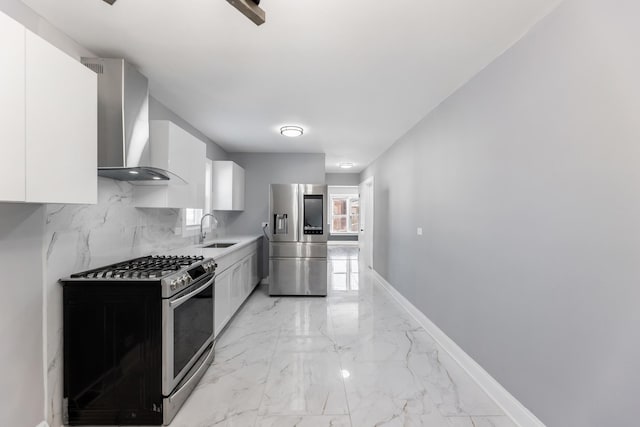 kitchen with white cabinetry, sink, wall chimney exhaust hood, and appliances with stainless steel finishes