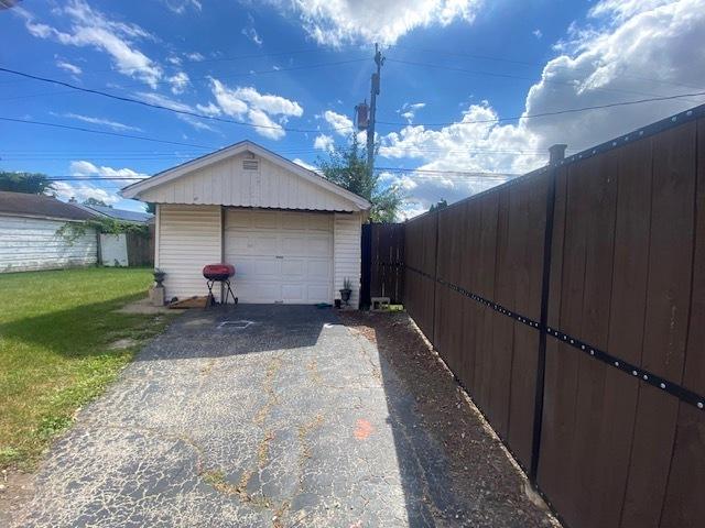 garage with a yard