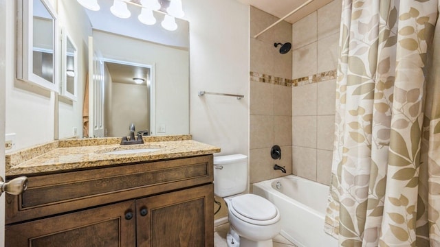 full bathroom featuring shower / bath combo with shower curtain, vanity, and toilet