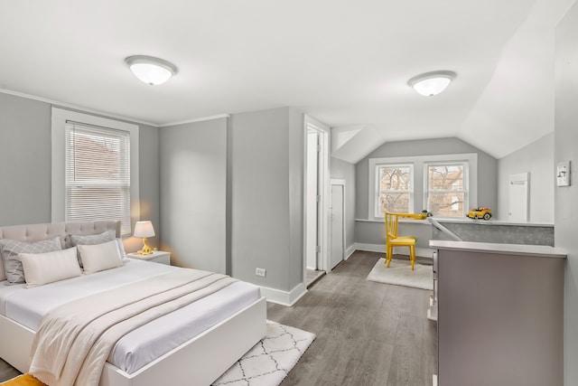 bedroom with hardwood / wood-style flooring and vaulted ceiling