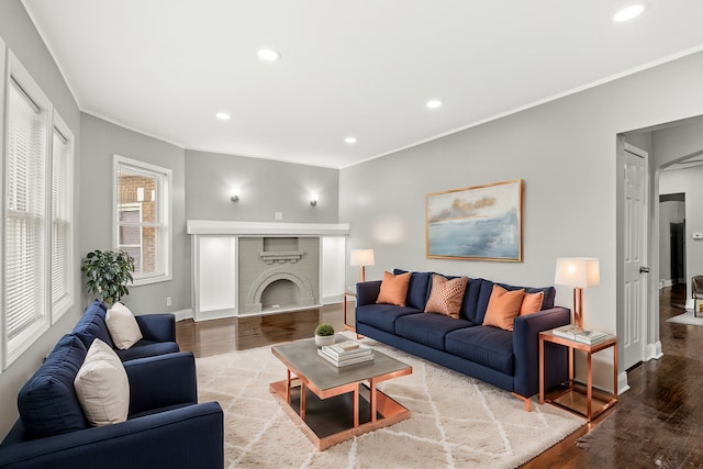 living room featuring ornamental molding and hardwood / wood-style floors