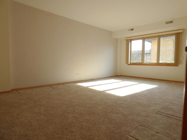 unfurnished room featuring carpet flooring