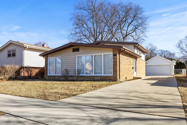 view of front of house with a garage and an outdoor structure