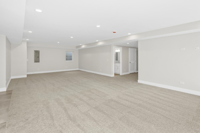 interior space featuring light colored carpet and electric panel