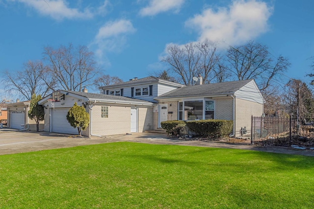 view of front of property featuring a garage and a front yard