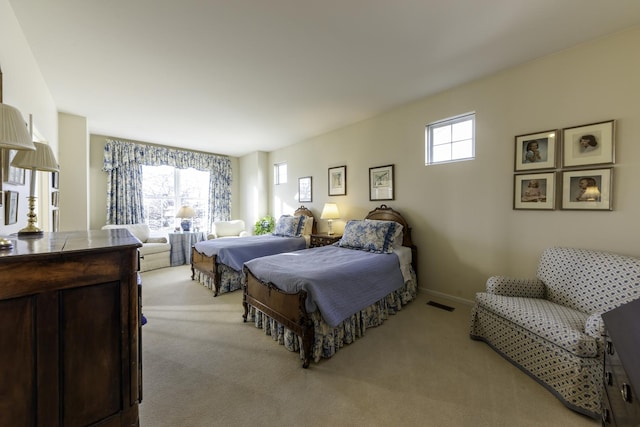 bedroom with light carpet