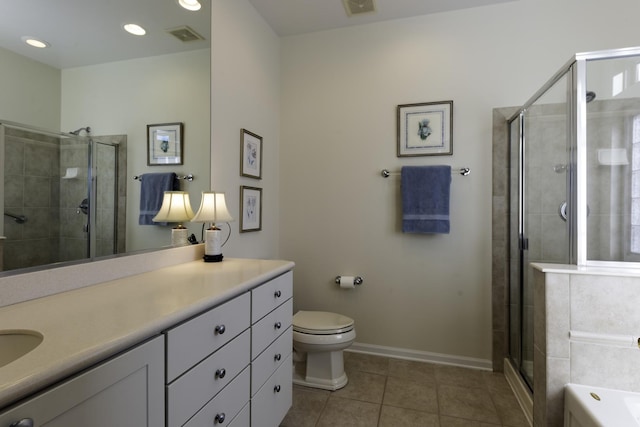 full bathroom featuring tile patterned flooring, vanity, shower with separate bathtub, and toilet