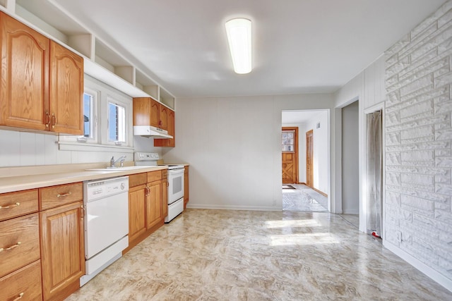 kitchen featuring sink and white appliances