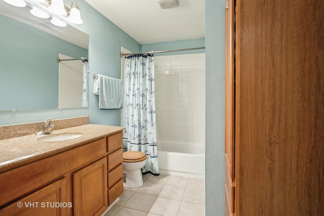 full bathroom featuring shower / bath combo, an inviting chandelier, vanity, tile patterned floors, and toilet