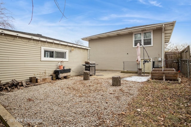 back of house with a patio