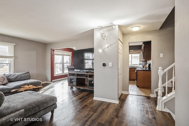 living room with sink and dark hardwood / wood-style floors