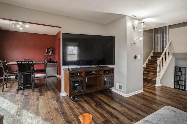 living room featuring dark wood-type flooring