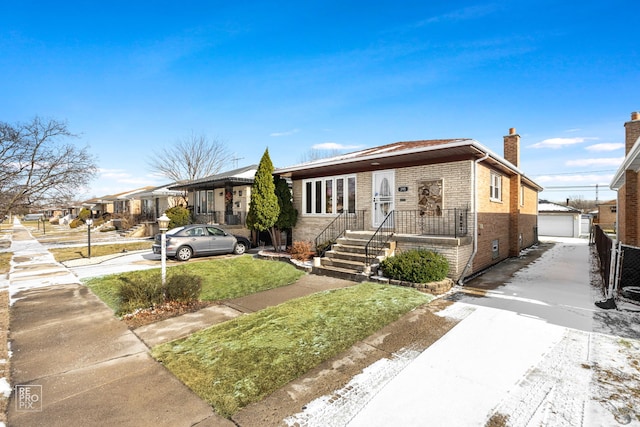 view of front of property with a garage and an outdoor structure