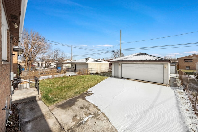 view of yard featuring an outbuilding and a garage