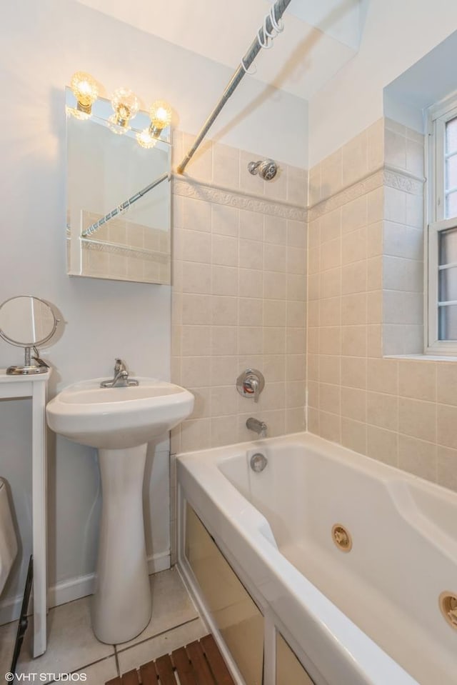 bathroom featuring tile patterned flooring and tiled shower / bath combo