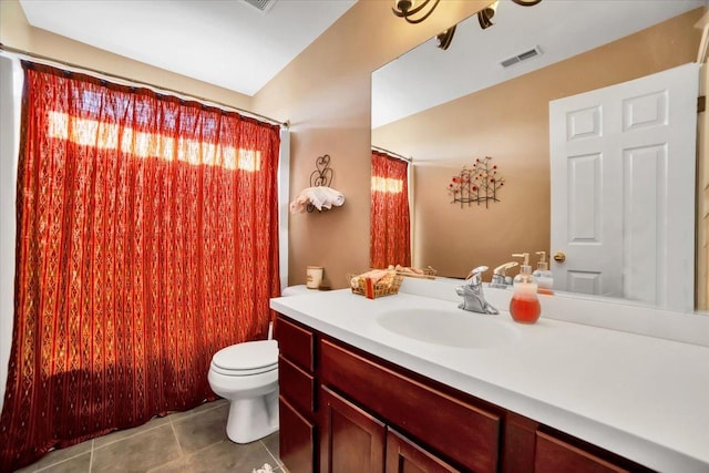 bathroom featuring tile patterned floors, toilet, and vanity