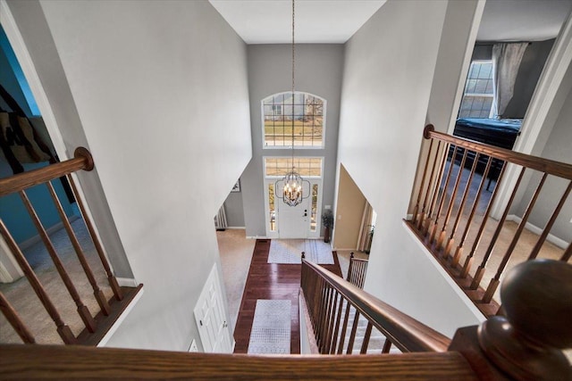 entryway featuring a high ceiling and a notable chandelier