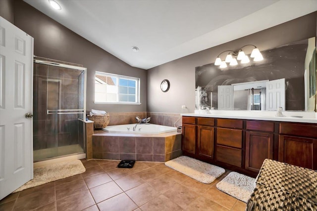 bathroom with lofted ceiling, vanity, tile patterned floors, and plus walk in shower