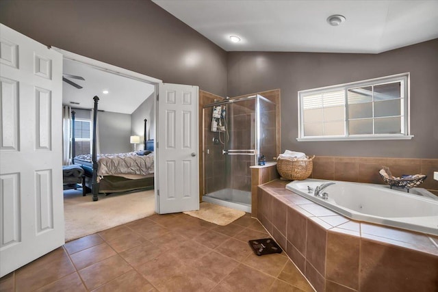 bathroom with tile patterned flooring, shower with separate bathtub, and lofted ceiling