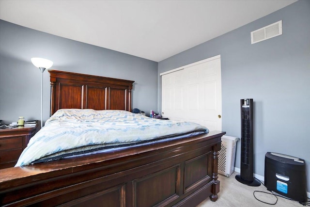 carpeted bedroom featuring a closet