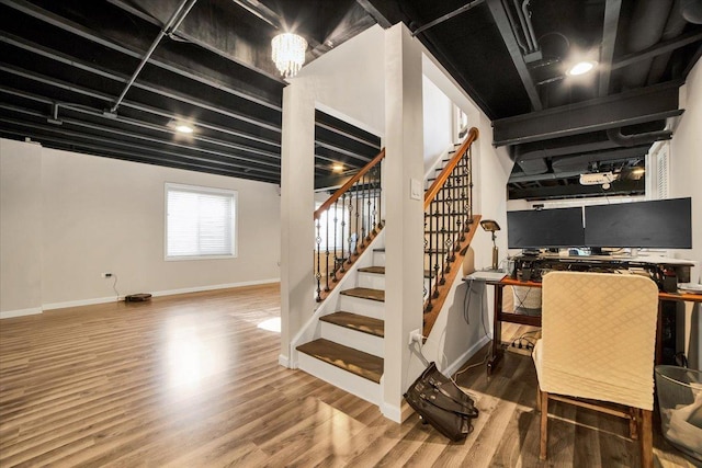 staircase featuring wood-type flooring