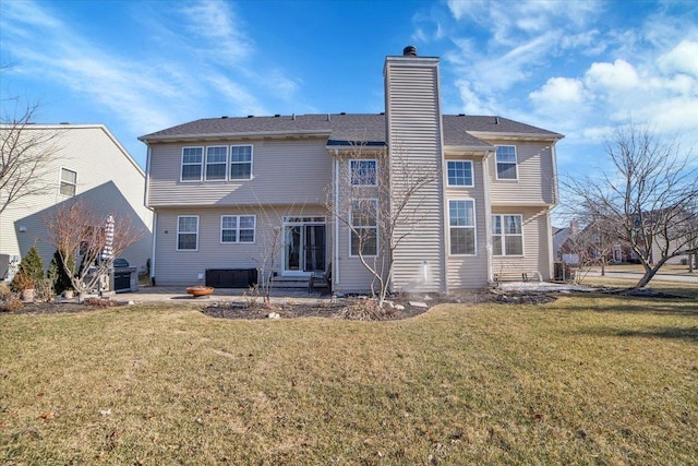 rear view of property featuring a yard, a patio area, and central air condition unit