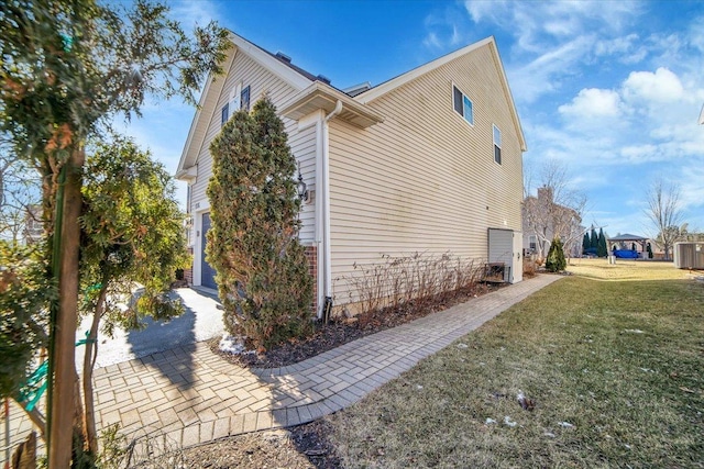 view of home's exterior with a yard