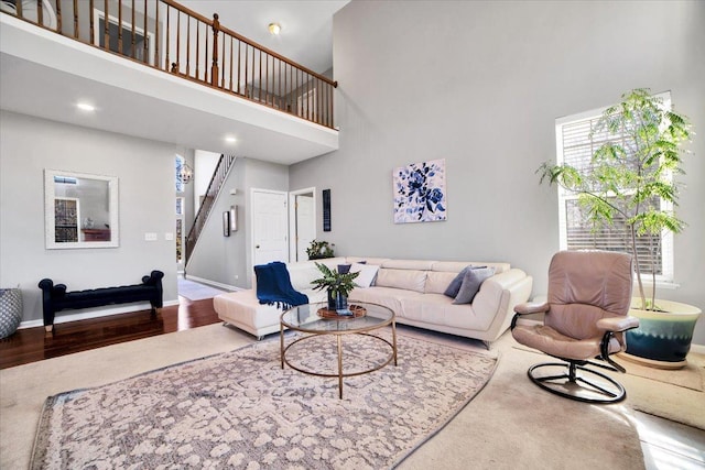 living room featuring a high ceiling