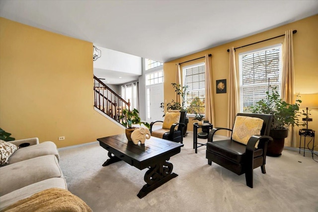 carpeted living room with a healthy amount of sunlight