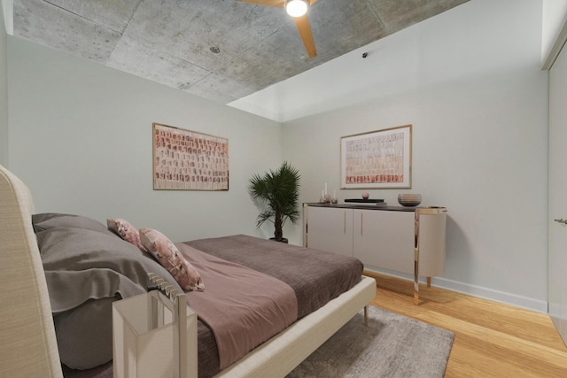 bedroom featuring hardwood / wood-style floors and ceiling fan