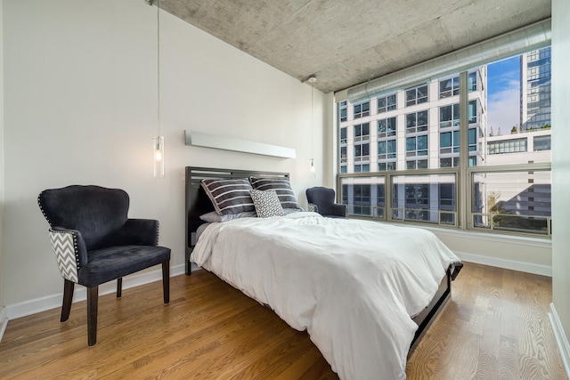 bedroom with hardwood / wood-style floors