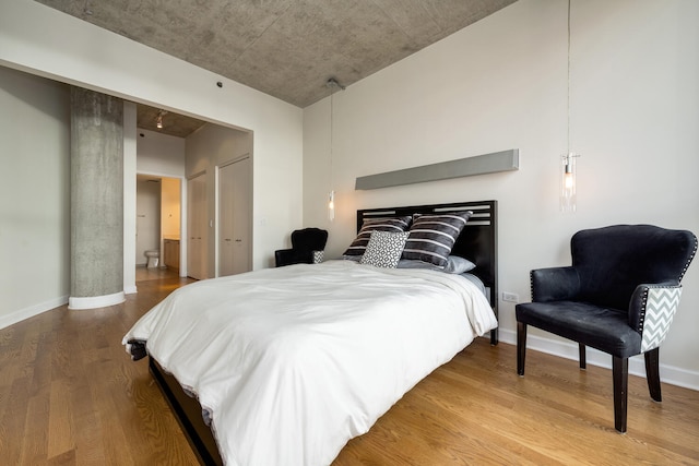 bedroom featuring hardwood / wood-style floors