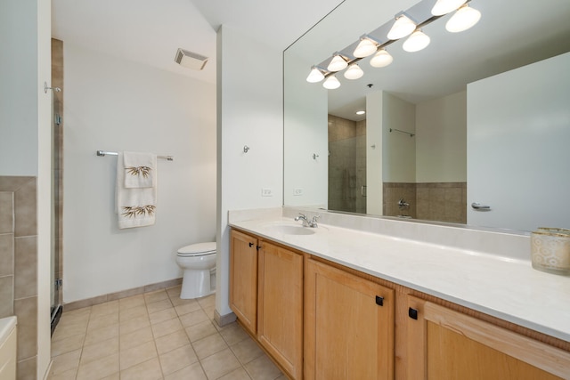 bathroom with vanity, toilet, an enclosed shower, and tile patterned flooring