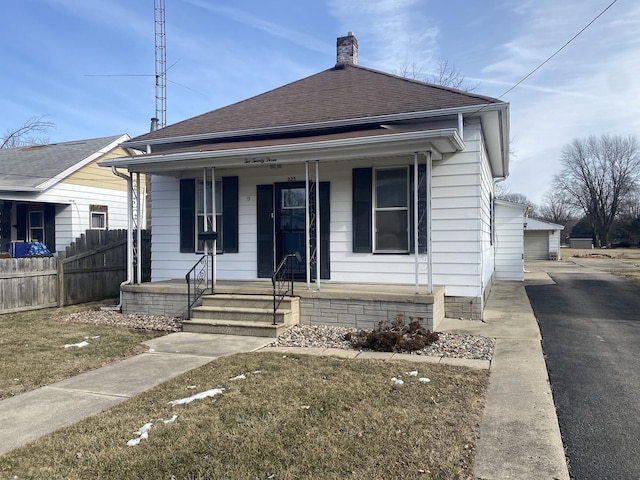 bungalow-style home with a porch and a front yard