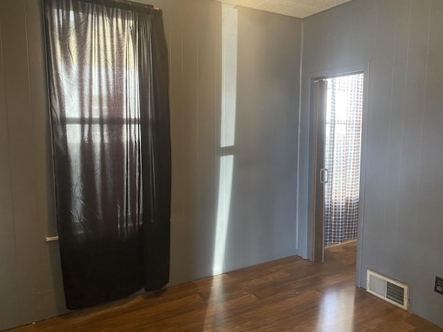 empty room featuring dark hardwood / wood-style floors