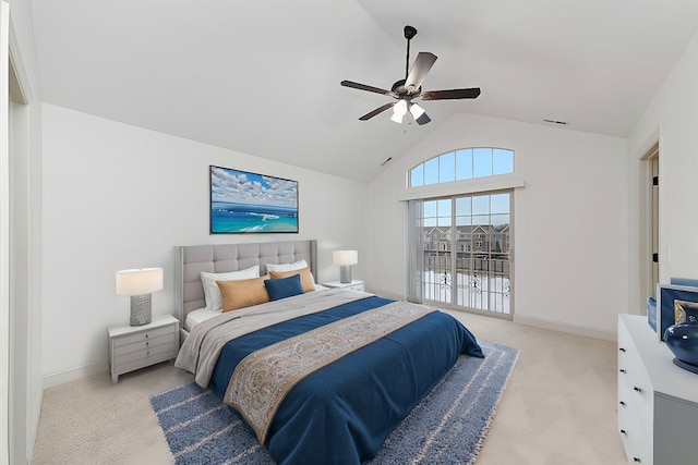 bedroom with lofted ceiling, light colored carpet, and ceiling fan