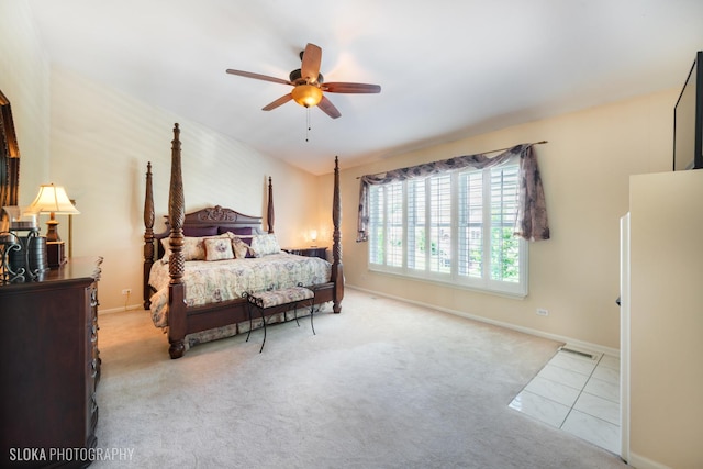 bedroom with light tile patterned floors and ceiling fan