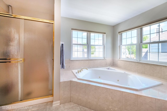 bathroom featuring separate shower and tub and tile patterned floors