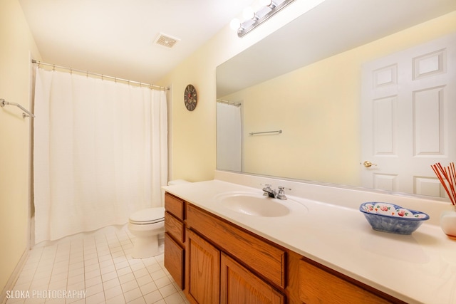 bathroom featuring tile patterned flooring, vanity, a shower with curtain, and toilet