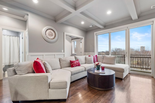 living room with dark hardwood / wood-style flooring, beam ceiling, and coffered ceiling