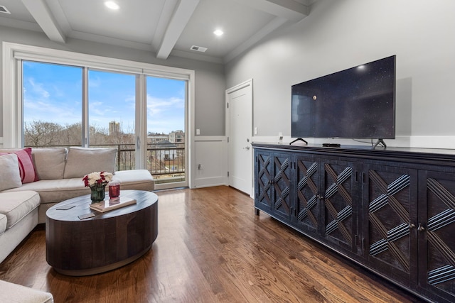 living room with dark wood-type flooring and beam ceiling