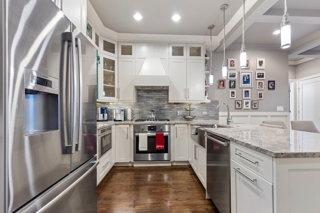 kitchen featuring white cabinetry, stainless steel appliances, sink, and light stone counters