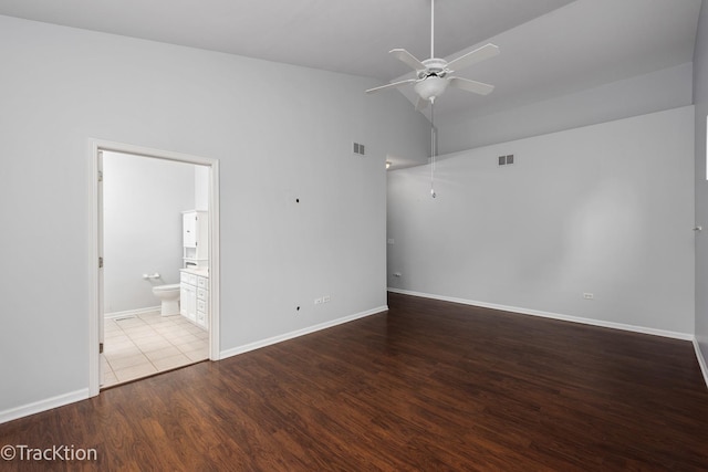 unfurnished room with high vaulted ceiling, hardwood / wood-style floors, and ceiling fan