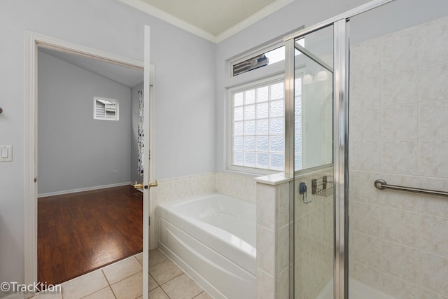 bathroom with tile patterned flooring, plus walk in shower, and vaulted ceiling