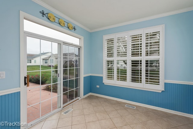 tiled empty room with crown molding